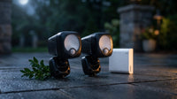 Black Smart Lighting Motion Activated Outdoor Integrated LED Spot Light Battery 2-Pack with Smart Lighting Bridge White — Lifestyle