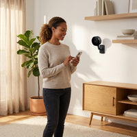 Wireless Indoor Plug-In Smart Security Camera with Night Vision, 2-Way Audio, Built-In Microphone & Speaker (Black) — Lifestyle